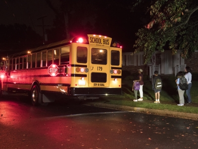 Kids Getting on School Bus in the Dark