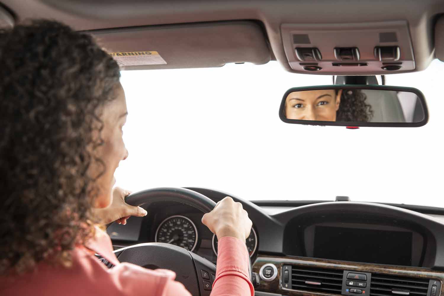 Driver Looking in Rearview Mirror